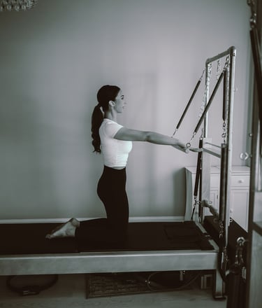 27 Pilates owner Tina Blondin photo on a reformer