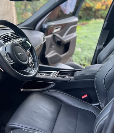 Sanitized SUV interior with clean cupholders and debris-free console