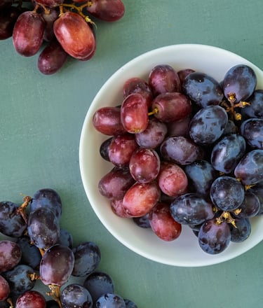 grapes with a bowl of grapes 