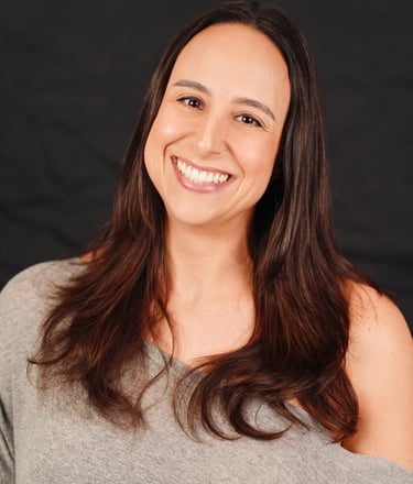 A photo of Silvia Saggiomo smiling warmly directly to the camera