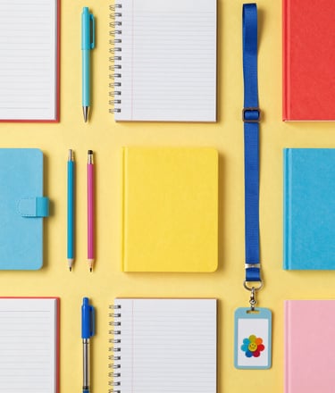 An elegant gift box filled with book-themed candles, bookmarks, and a beautifully wrapped novel.