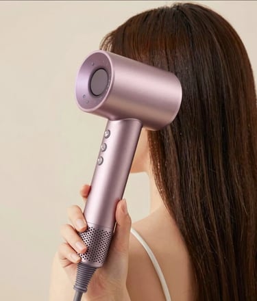 Close-up of elegant beauty tools like brushes and sponges resting on a smooth marble surface with warm, natural light