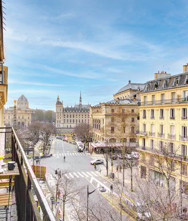a balcony with a view of a city street