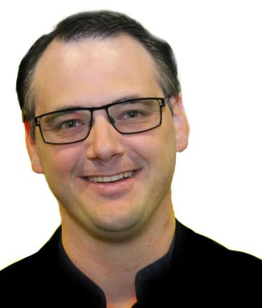 a man in a black shirt and glasses