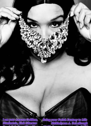 MsMadyson covering her face with a jeweled mask