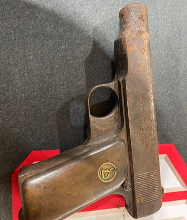 a corroded and rusty firearm 