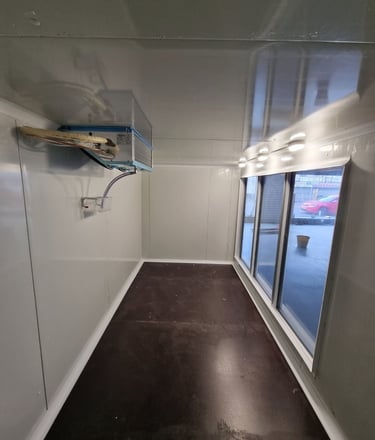 a glass cold room with slim evaporator