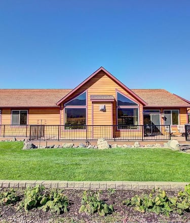 26205 sliding Horse Ln - Back of wood panelling house -Saddle Horn Custom Homes