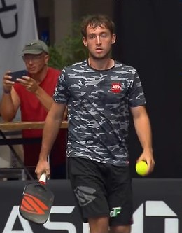 Dylan Frazier preparing to serve