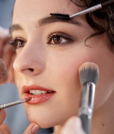 a woman is getting ready to be a make - up