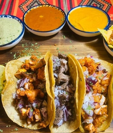 a table with a variety of tasty tasty tacos