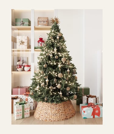 ELYKEN 28-Inch Woven Rattan Christmas Tree Collar, shown on a decorated tree