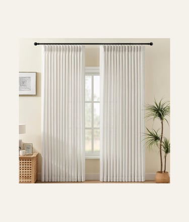 Elegant white pleated curtains on a black rod in a modern minimalist living room with a houseplant.