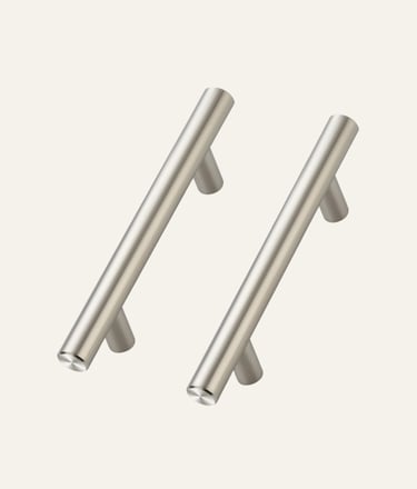 Two modern brushed nickel cabinet pulls with a sleek T-bar design for kitchen drawers.