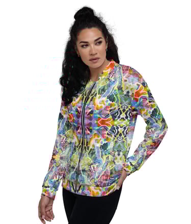 a woman in a colorful jacket and black pants