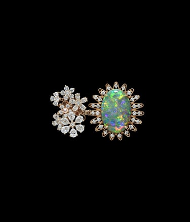 Dior ring with floral diamond design and large opal centerpiece.