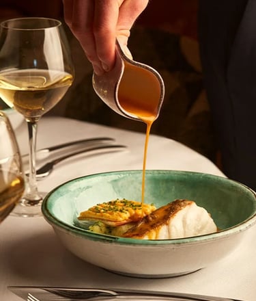 Gourmet dish with sauce at La Môme, The Berkeley.
