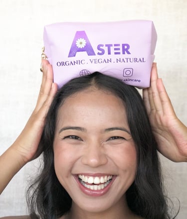 a very happy woman with Aster's purple pouchel bag on her head