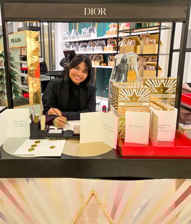 On-site calligrapher customizing holiday cards for Dior brand activation