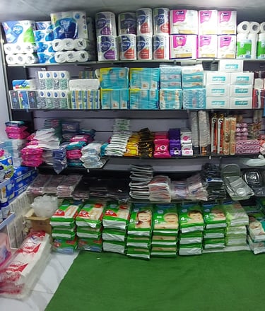 a store with a lot of toilet paper rolls