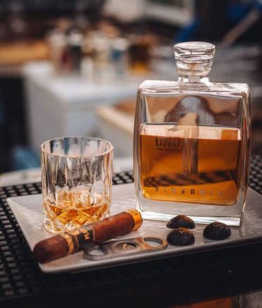 a glass of luxury Uno tequila Sinfonia and cigars - extra añejo