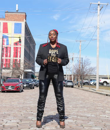 Genia Myers Collins posing confidently in Buffalo NY