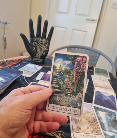rob hamilton holding a tarot card