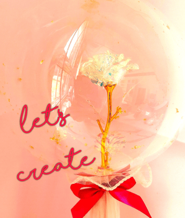 a clear glass vase with a flower inside