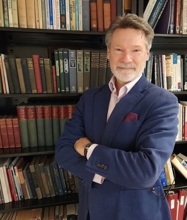 Picture of J. Andrew Kuypers bookcase in background