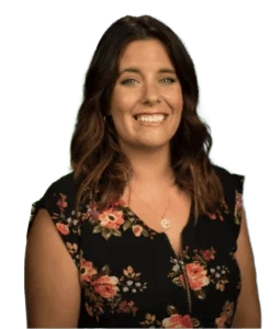 a woman in a floral dress smiling