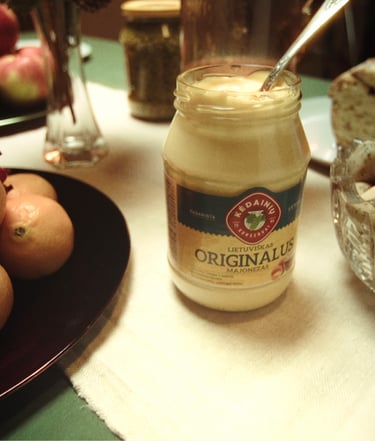 a jar of cream with a glass jar of milk