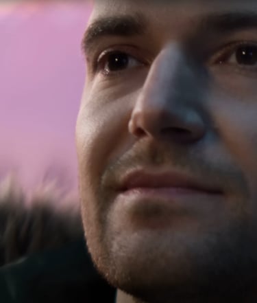 a man with a beard and a beard, looking at the camera