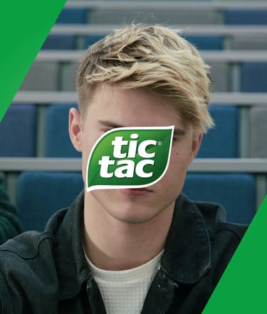 a man with a green sticker on his face