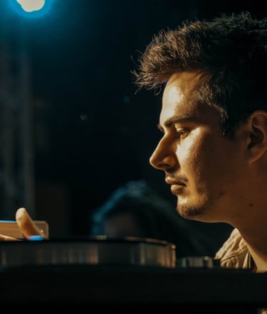 a man sitting at a table with a laptop