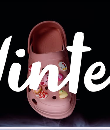 a pair of pink shoes with a pink flowered shoe