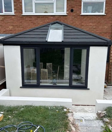 Rendered wall detail showing a seamless finish on an outdoor extension.