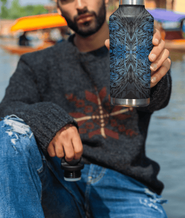 a man holding a water bottle in his hand