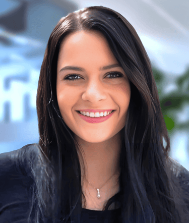 a woman with long hair and a black top