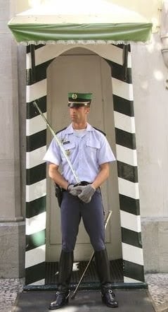 Lisbon - An official guard to a historic building under repair