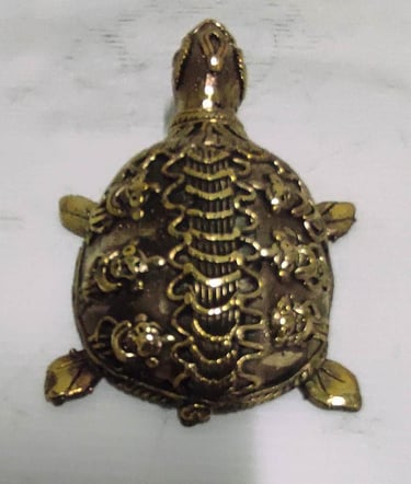 "Handcrafted brass turtle with engraved floral design–Vastu and home decor piece-Prepared for export"
