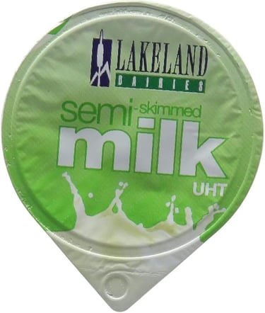 a container of milk with a green and white label