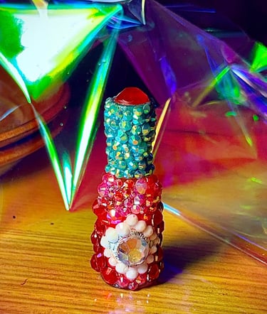 Mini Tabasco bottle covered in rhinestones