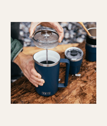 picture of a navy blue yeti french press with coffee inside