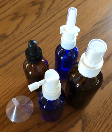 group of spray bottles for use with colloidal silver, comes with filling funnel