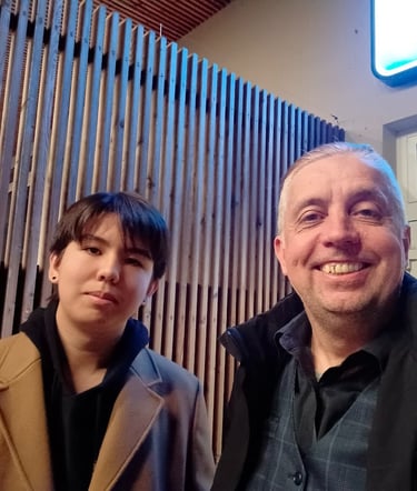 a man and a son standing next to each other