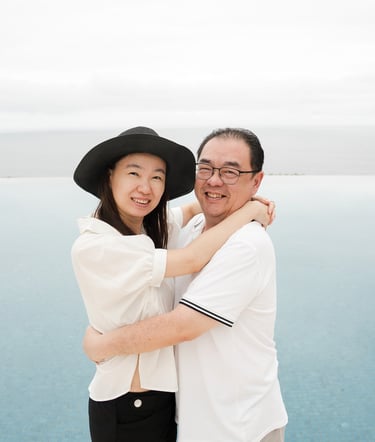 Couple embracing near infinity pool at Alila Villas Uluwatu Bali with ocean view background