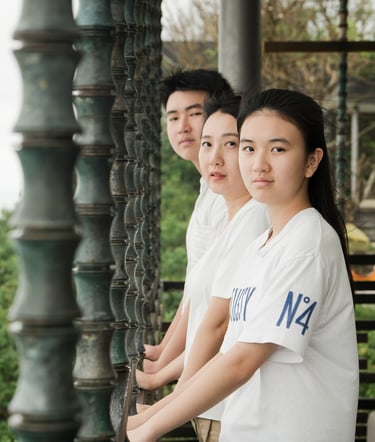Children portrait framed by architectural elements at Alila Villas Uluwatu Bali with calm and natural expression  
