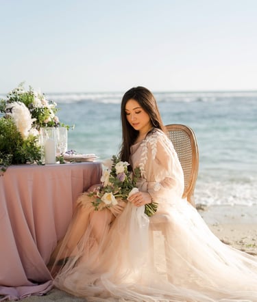 Luxury bride seated by the ocean during prewedding at Melasti Beach Bali