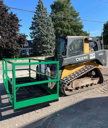 Custom man basket work platform lowered by skid steer