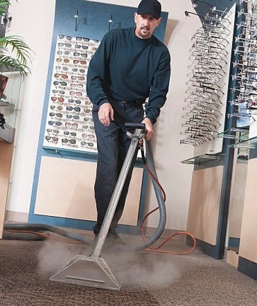 Steam cleaning the carpet